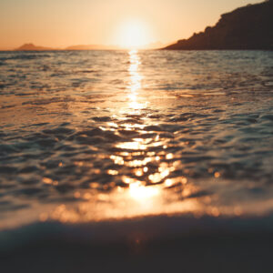 sunlight streaked sea scaled