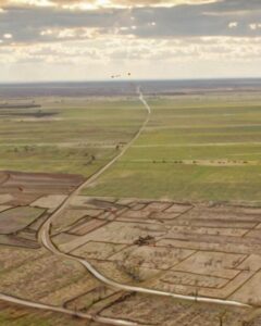 image of land divided by a river setting context